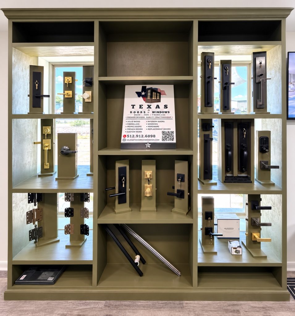 Door handles, locks, hinges, and hardware samples displayed at the Texas Doors & Windows showroom