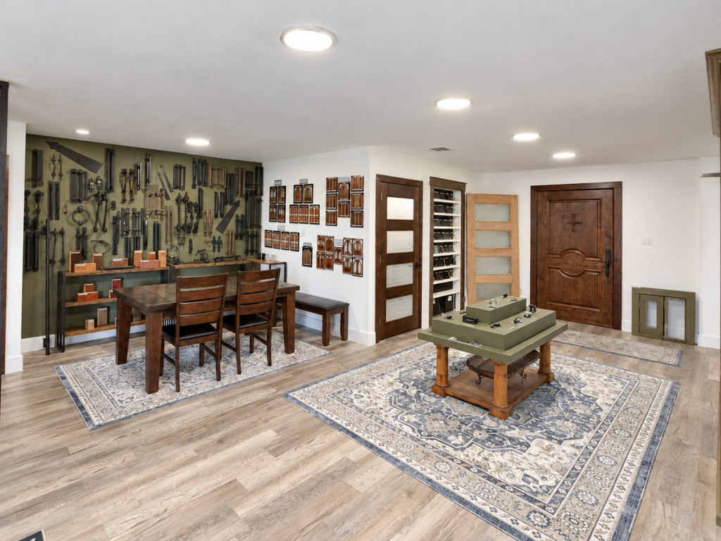 Texas Doors and Windows showroom with decorative door hardware displays, wooden tables, and sample doors