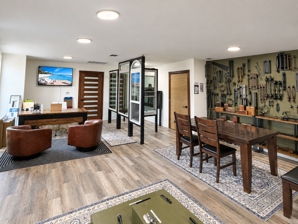 Showroom consultation area featuring door and window displays, seating, and hardware samples
